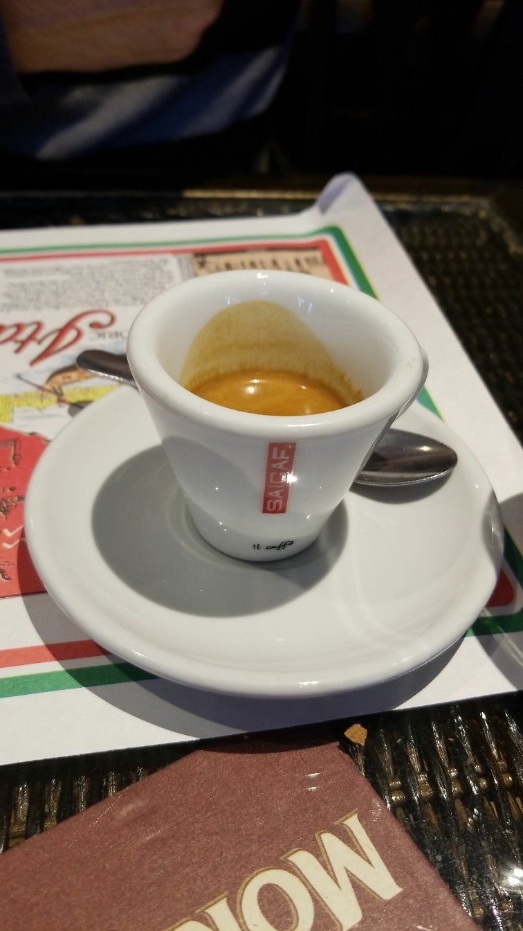 Espresso in a white cup on the table